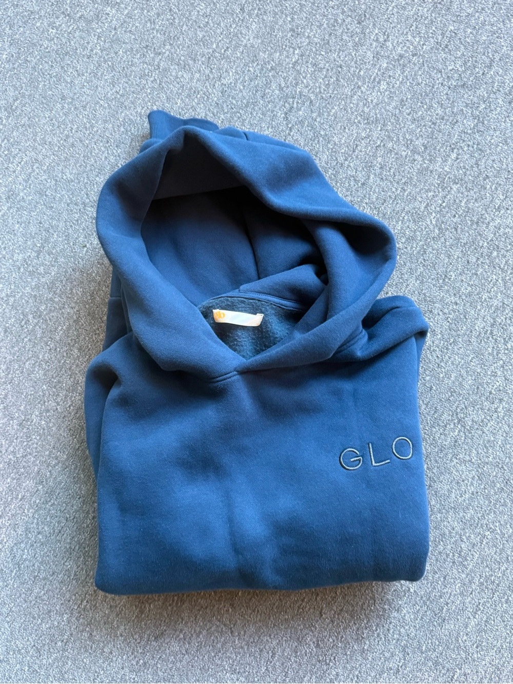GLO “FORGIVEN”Unisex Hooded Sweatshirt in Deep Teal Blue